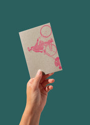 Postcard - Man on a bike, pink on kraft (single or set)